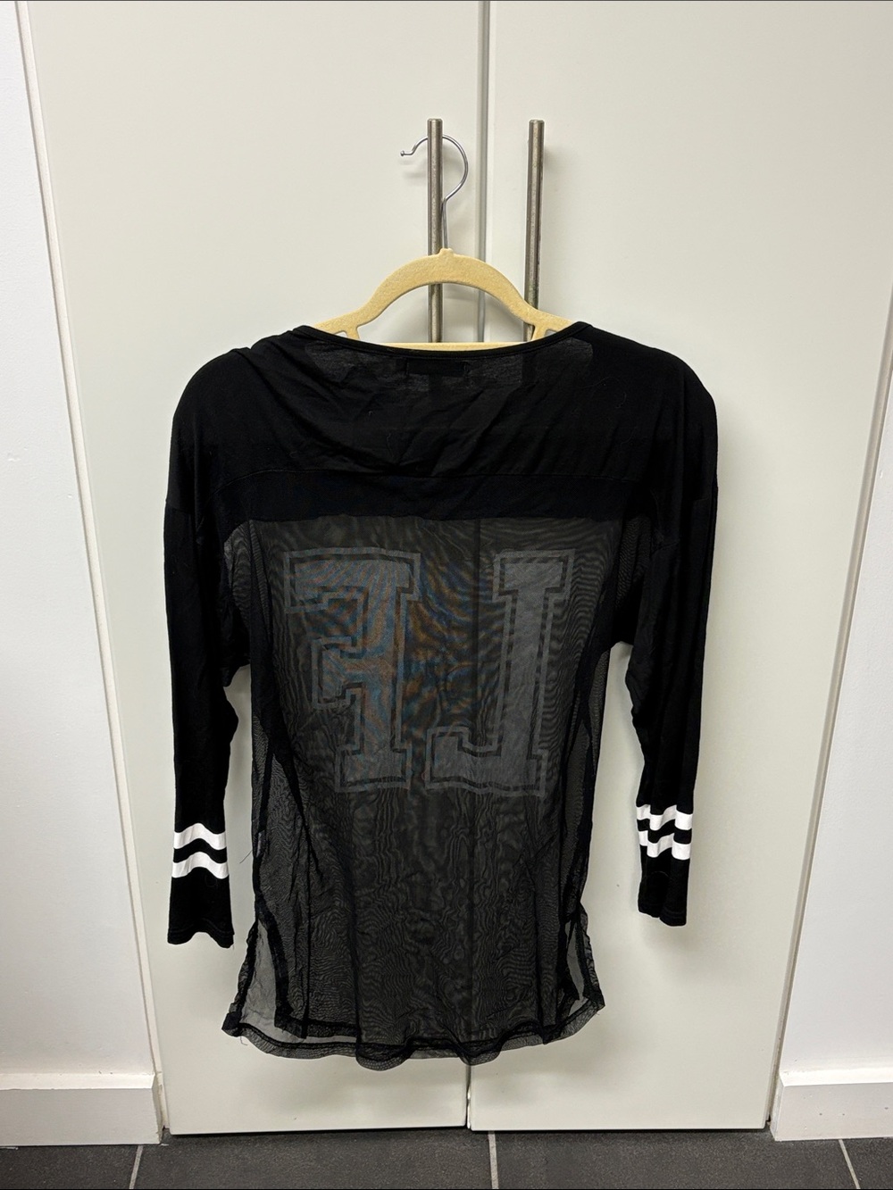 LF Black Sheer Long Sleeve Top with White Lettering and Striped Cuffs - Picture 2 of 2